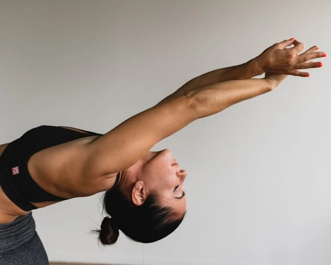 A practitioner arching into a deep heart-opening pose