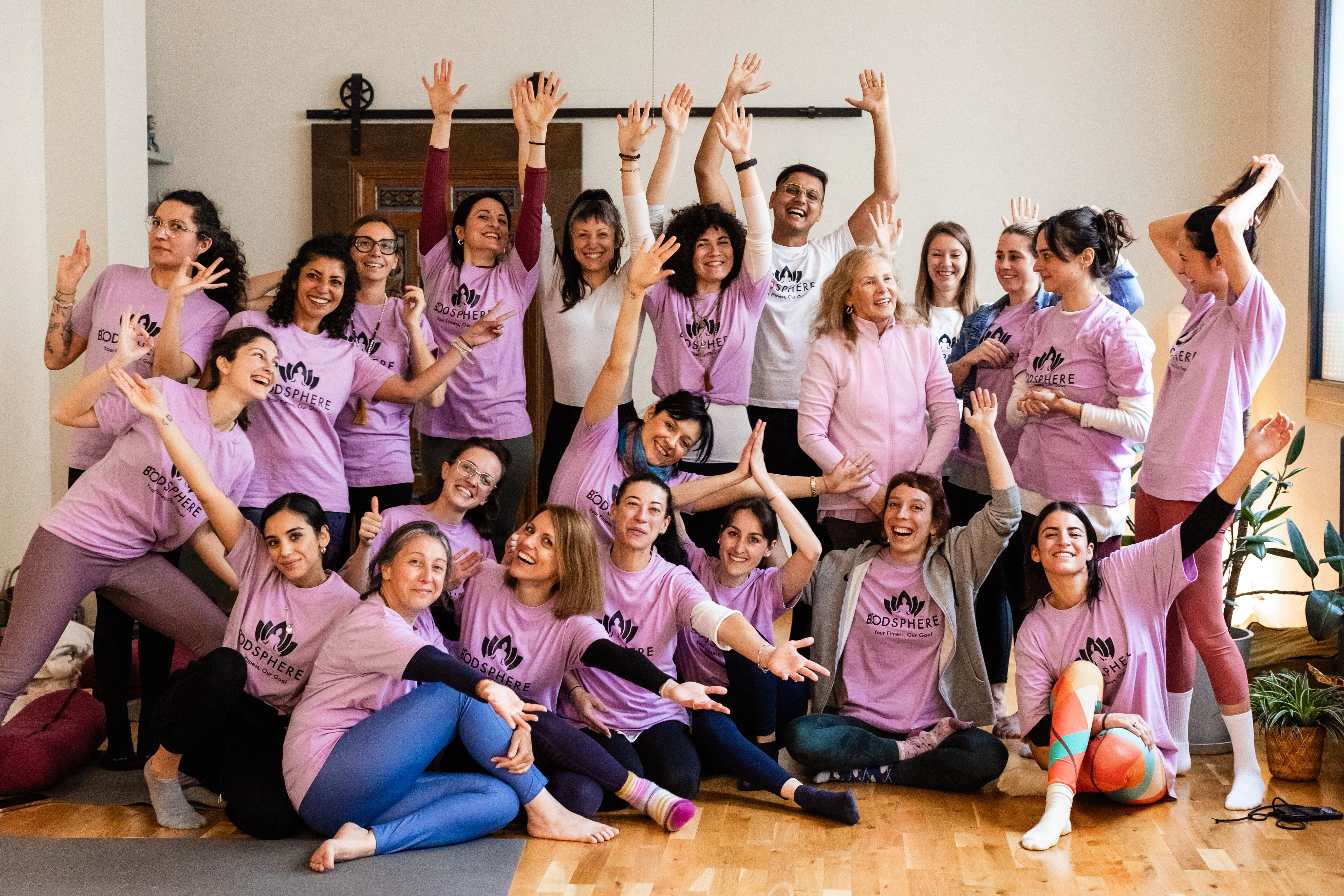A graduating Bodsphere teacher-training cohort holding their certificates
